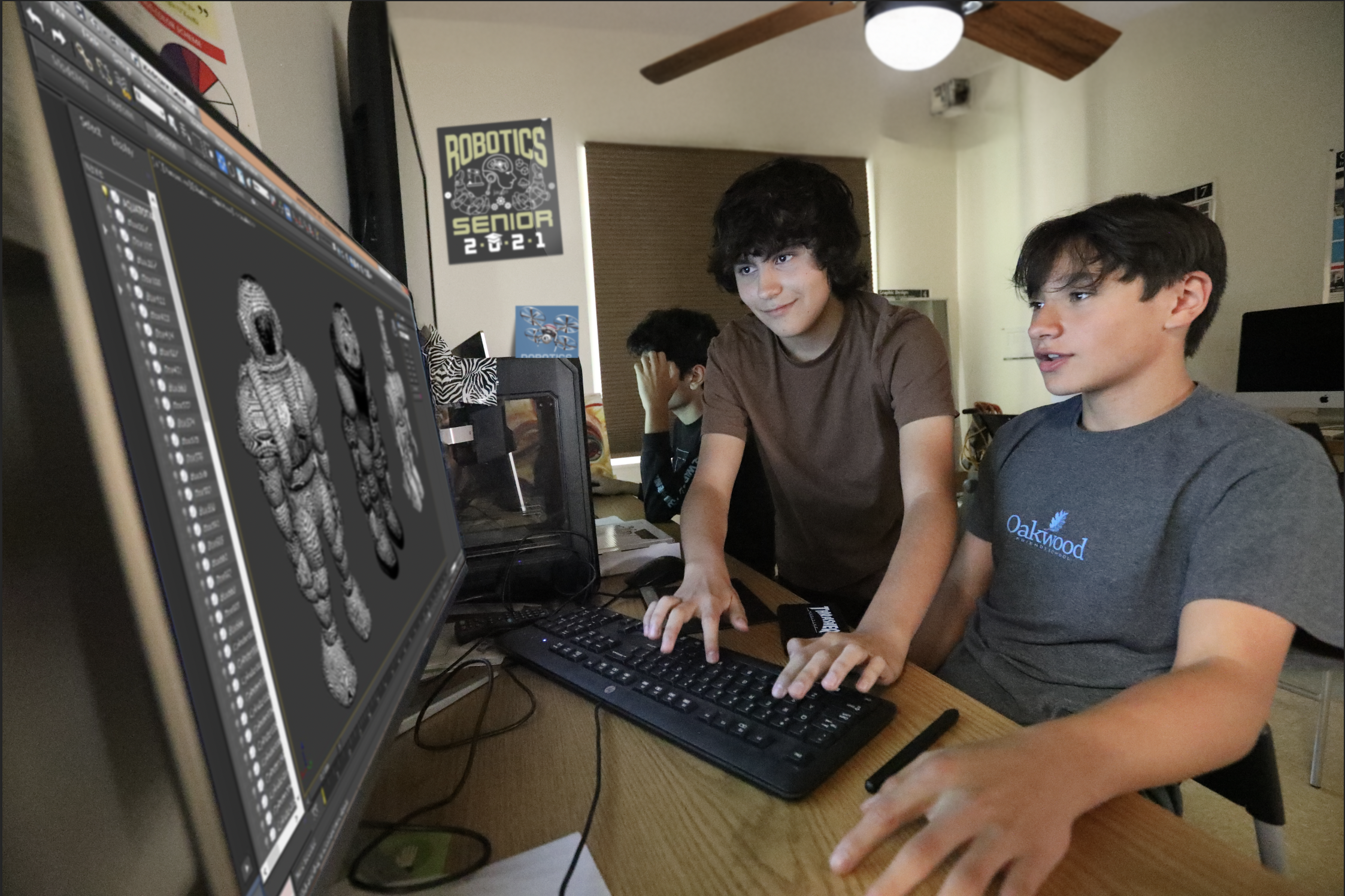Oakwood Robotics club members design a robot